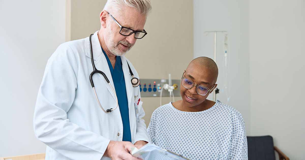 Doctor showing form to patient