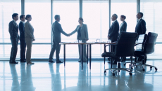 Executives shaking hands
