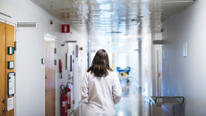 Nurse walking down corridor
