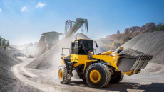 Construction equipment moving around a work site