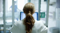 Clinician at computer screen
