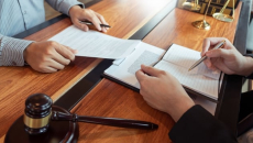 Lawyers sorting through paperwork