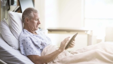 Patient in bed and on phone at hospital