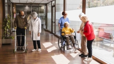 Nurses and patients in nursing home
