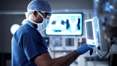 Surgeon looking at a monitor