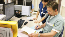 Nurse and doctor at computer