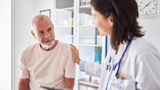 Female doctor with senior patient