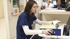 Busy clinician at computer