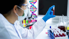Researcher looks at a blood sample.