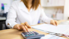 A person using a calculator