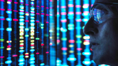 Scientist looking at DNA on a screen