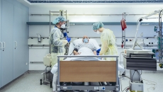 Healthcare professionals at a hospital bed