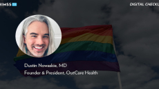 Dr. Dustin Nowaskie, OutCare Health_Rainbow flag waving in the wind by Alexander Spatari/Getty Images