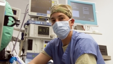 Healthcare professional with computers and screens