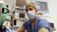 Healthcare professional with computers and screens