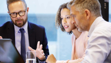 Executives in discussion in a conference room
