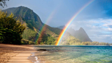 Hawaiian beach and hills with rainbows