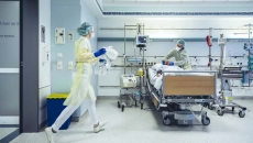 Hospital room with patient and caregiver
