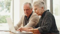 Couple using a laptop