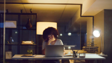 A woman is stressed at work