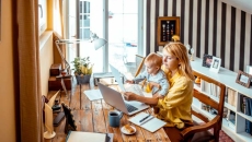 Adult and child at computer. Photo: Marko Geber/Getty Images