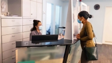 Patient at reception desk