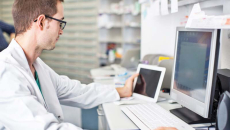Pharmacist at screens