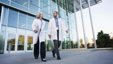 Medical professionals walking out of building. Photo: Peter Griffith/Getty Images