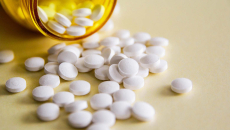 Pills spilling out of a bottle