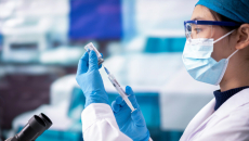 healthcare professional prepping syringe