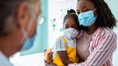 Adult and young child at a physician's visit