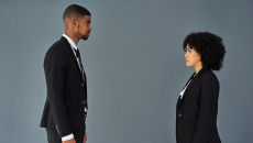 Two businesspeople face each other