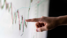 Finger pointing to a graph