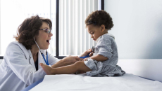 Doctor examining toddler