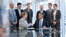 Business deal participants with handshake