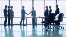 Business people greeting in a lobby