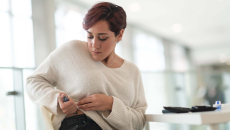 Person injecting medication in hip