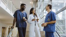 Doctor and two nurses on break in hopspital stairway