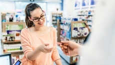 Person checks out at pharmacy counter