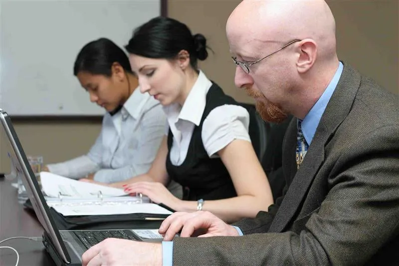 Three people working Three people working