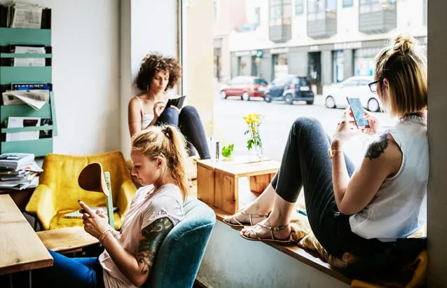 People on phones together People on phones together