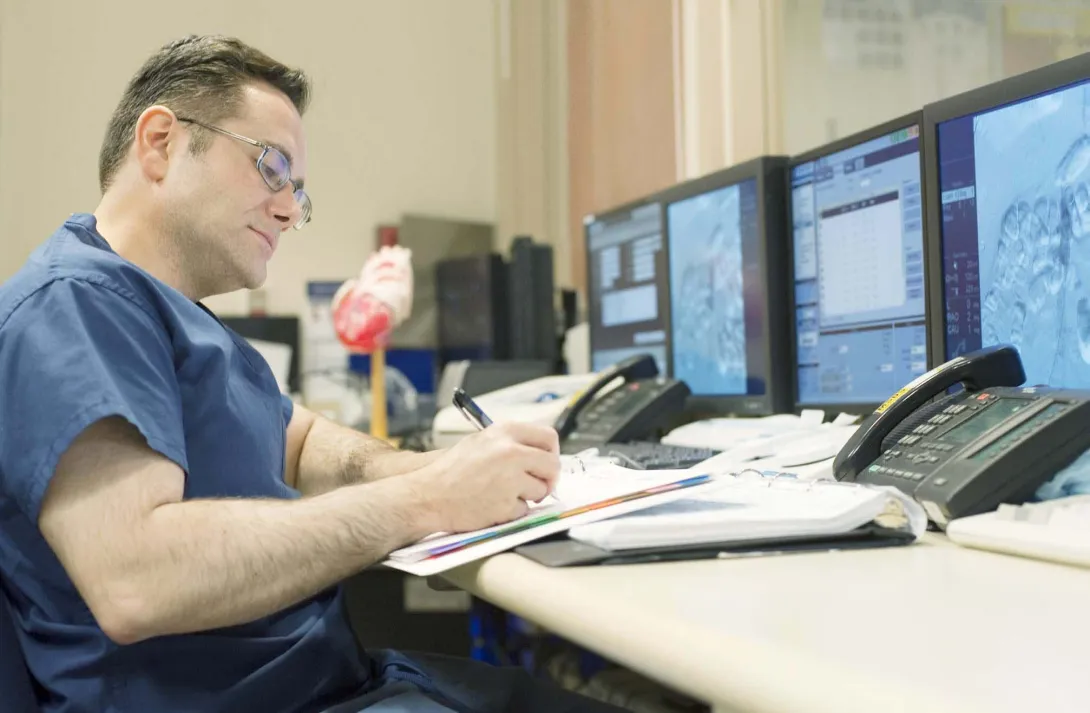 Clinician at a computer Clinician at a computer