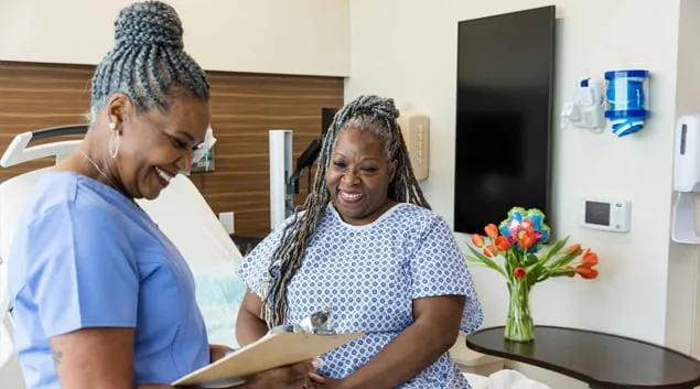 Nurse consulting with patient Nurse consulting with patient