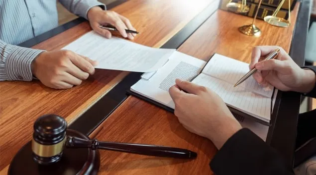Lawyers examining paperwork Lawyers examining paperwork