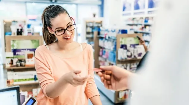 Person getting pills from the pharmacy Person getting pills from the pharmacy