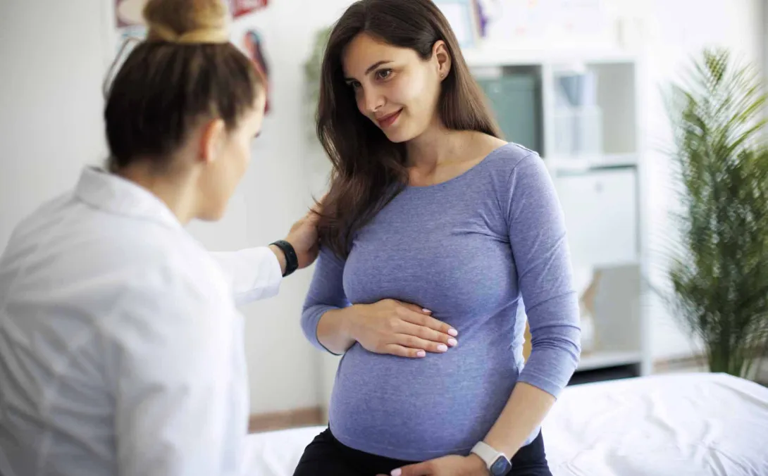 Pregnant woman with her doctor