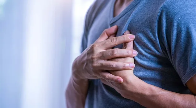 Person clutching their heart