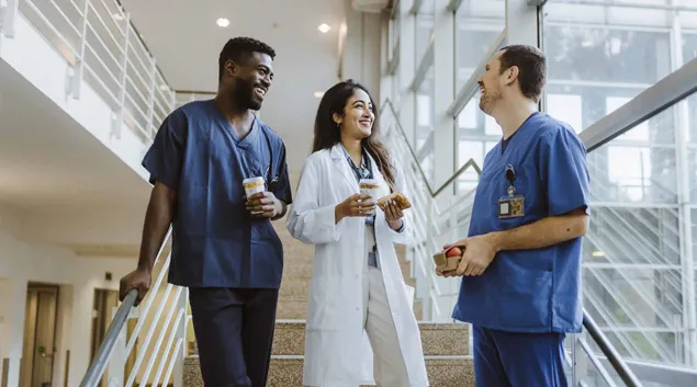 Clinicians talking in a hospital