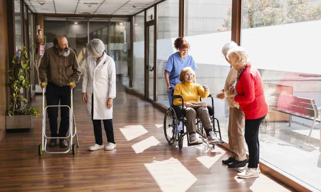 Nurses and patients in nursing home