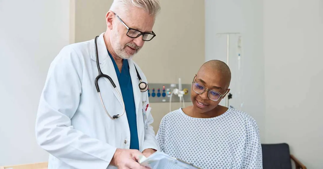 Doctor showing form to patient